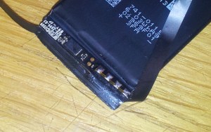 iPhone 4 battery PCB with soldered-on flat flex connector