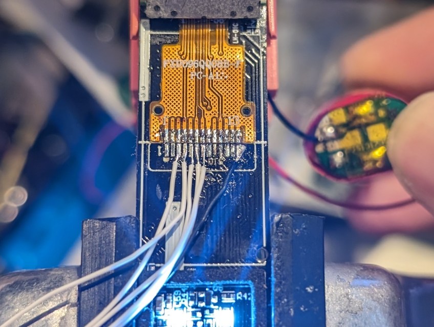 Wires connected to LCD for traffic sniffing.